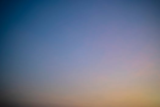 Abstract nature background of romantic pastel sky with silky wispy cloud in golden hour time photo