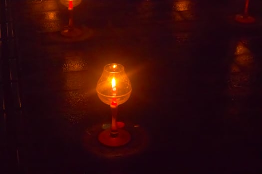 A candle is are lit at borobudur temple. symbol of hope photo