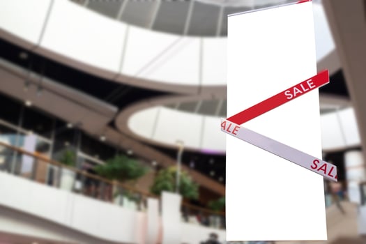 Discount percentage sign display in fashion department store during sale season period. photo