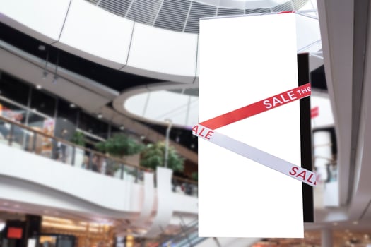 Sale tag of offering special promotion hanging in shopping mall photo