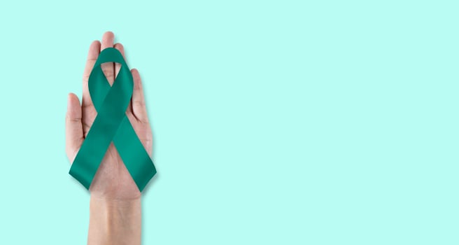 Teal awareness ribbon awareness for Ovarian Cancer month, cervical cancer, Polycystic Ovary Syndrome photo