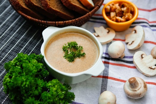 Creamy Mushroom Soup With Parsley Garnish photo