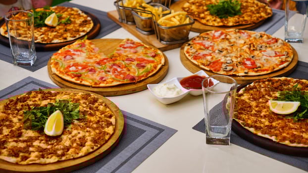 Turkish Pizza and Sides on a Restaurant Table photo