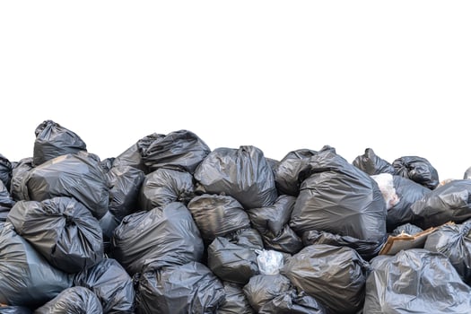 Wrinkled plastic bags texture pattern. Plenty of biodegradable bags piled up against on white isolated background photo