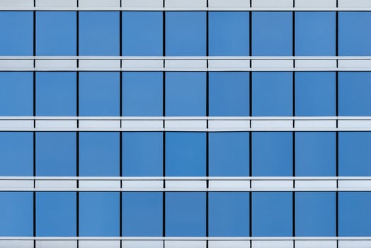 Front view on the glass modern building facade photo