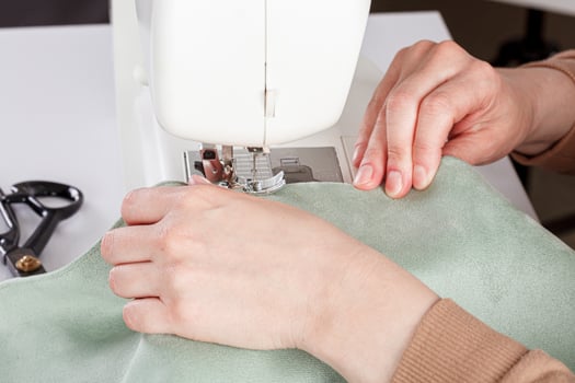 Sewing machine, stitching fabrics, needle in a round plan photo