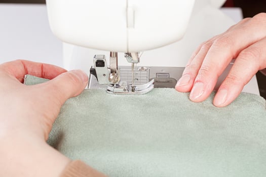 Sewing machine, stitching fabrics, needle in a round plan photo