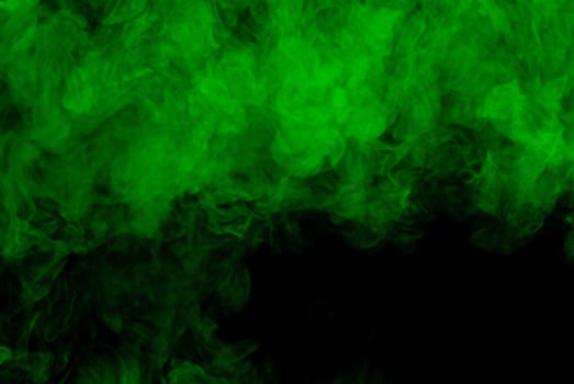 Green Smoke Plume Against Dark Background photo