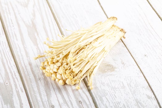 Tasty raw enoki mushroom heap photo
