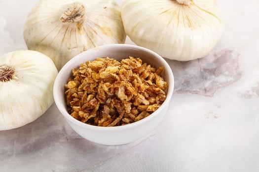 Dried roasted onion flakes for culinary photo