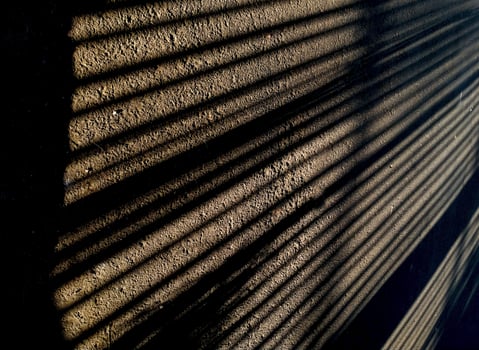 Abstract geometric from a shadow pattern on the asphalt street, long lines in monochrome tones. Copy space for text photo