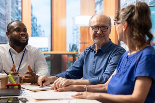 Elderly people consulting a financial advisor about their retirement planning, long term financial stability. Receiving professional advice on pension options from an expert banker. photo