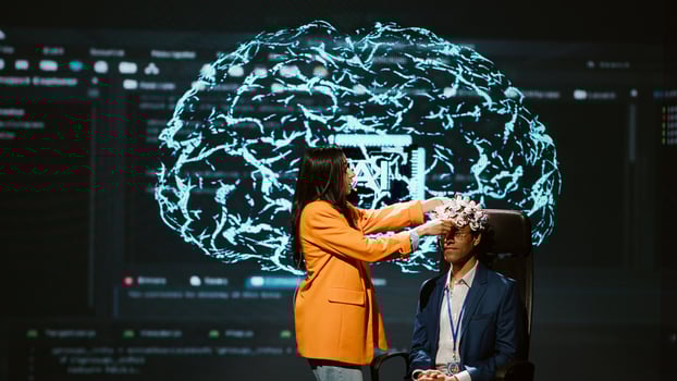Company CEO using summit as platform to launch latest AI EEG headset product. Neuroscientist doing demonstration at forum in front of business leaders interested in artificial intelligence, camera A photo