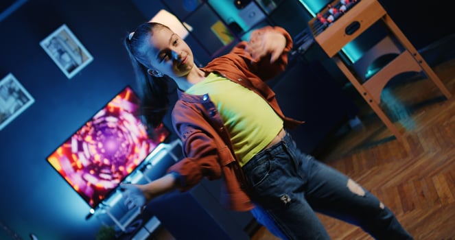 Cute kid getting tons of engagement on her dancing clips posts on social media platforms. Influencer child filming viral videos, impressing audiences with energetic dance moves photo