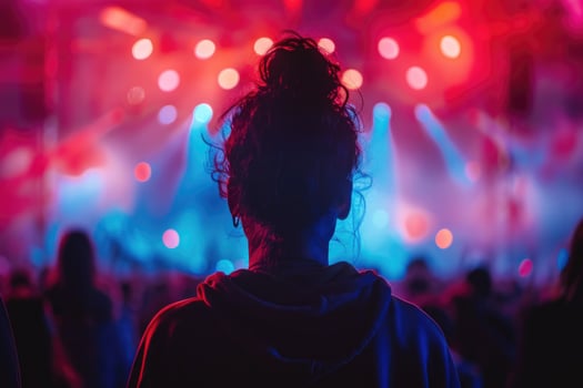 silhouette of african american woman in neon light on rock concert. photo