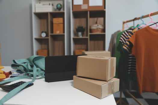 vlogger, blogger small SME business asian beautiful woman using mobile phone call for sell clothes live stream selling online, show product present detail at home office, entrepreneur ecommerce photo