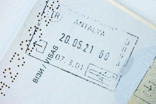 KYIV, UKRAINE - APRIL 20, 2024 Page of foreign passport with visas, Turkiye border stamps, permits to enter countries, concept of traveling around the world, travelers document photo