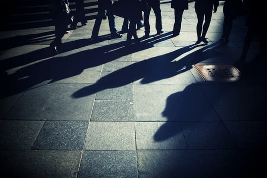 Shadows of people on the pavement photo