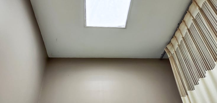 Background view of the ceiling of a hospital patient's room from the perspective of a bedridden patient. Clinical healthcare recovery treatment room ward. photo