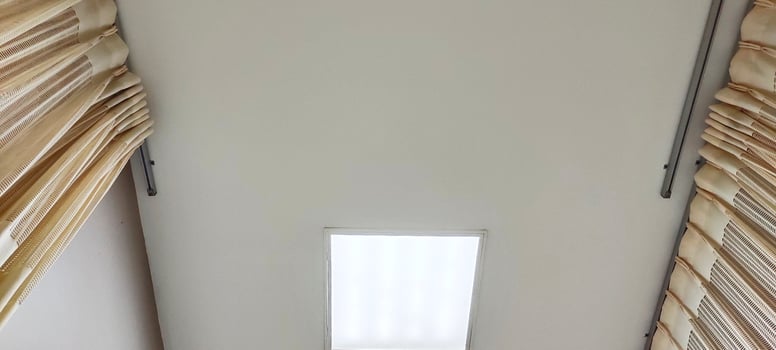 Background view of the ceiling of a hospital patient's room from the perspective of a bedridden patient. Clinical healthcare recovery treatment room ward. photo