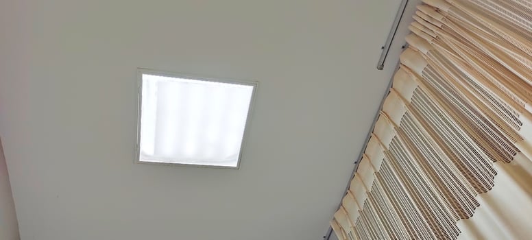 Background view of the ceiling of a hospital patient's room from the perspective of a bedridden patient. Clinical healthcare recovery treatment room ward. photo