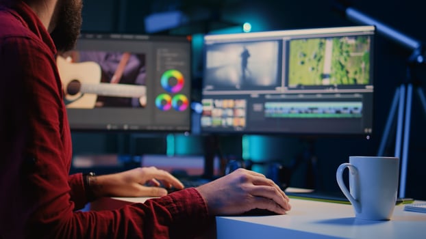 editor arranging recorded stock clips into seamless whole in creative multimedia agency. Videographer manipulating film pieces, assembling recorded footage into finished project photo