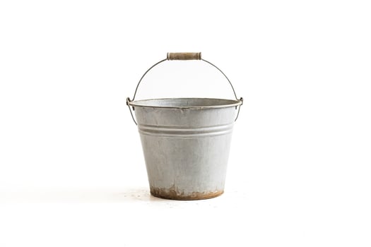 Metal bucket on white background photo