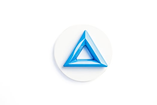 Blue triangle on white background photo