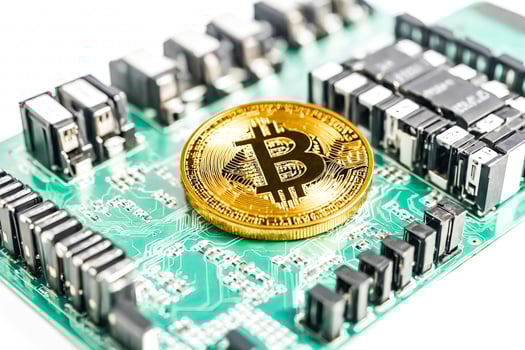 Bitcoin on Circuit Board photo