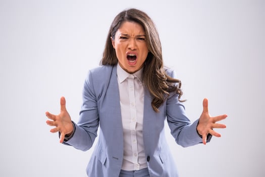 Portrait of angry businesswoman who is yelling. photo