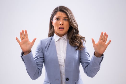 Portrait of frustrated businesswoman who is looking at camera in disbelief. photo