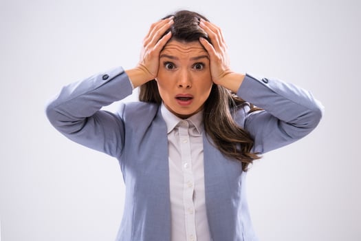 Portrait of frustrated businesswoman who is looking at camera in disbelief. photo