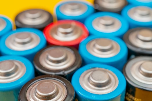 Used batteries. Waste collection and recycling. Environmental Protection. Batteries background. photo