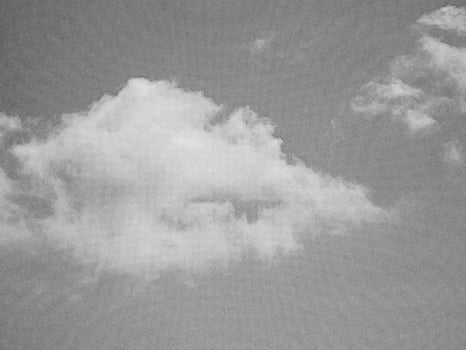 White fluffy cloud over blue summer sky background. Pencil drawn sketch illustration photo