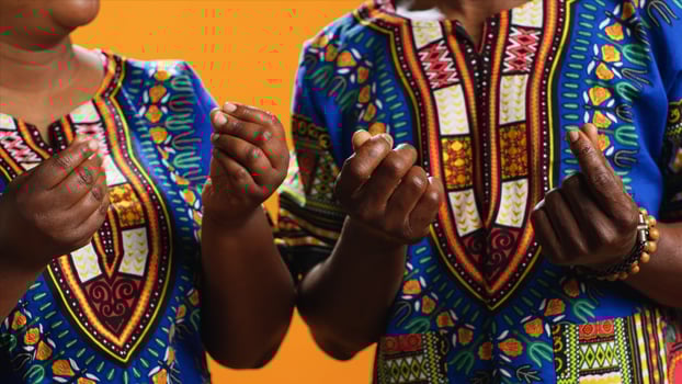 Poor african american people begging for money with hand sign, rubbing fingers together in order to receive cash income. Couple with financial issues asking for their salary to pay bank loans. photo