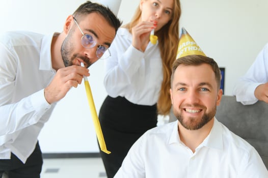 business team celebrating a birthday in the office. photo
