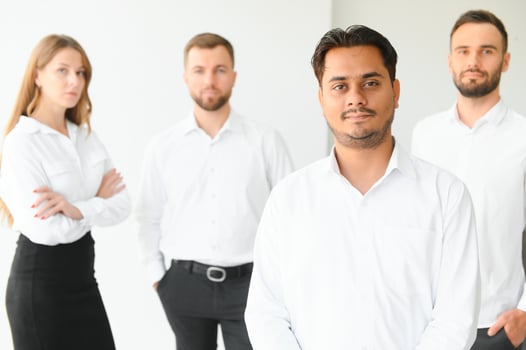 Business people stand on the background of the office corridor photo