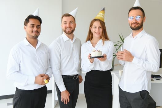 Business team celebrating a birthday of collegue in the modern office. photo