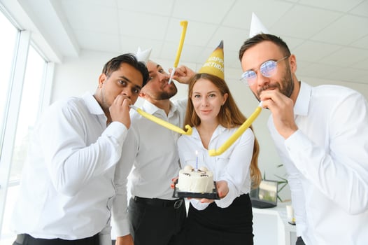 corporate party and people concept - happy team with cake celebrating colleague birthday at office photo