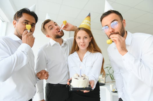 business team celebrating a birthday in the office. photo