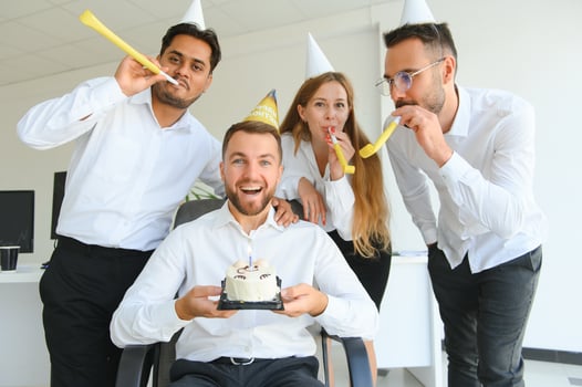 Business team celebrating a birthday of collegue in the modern office. photo