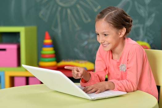 Portrait of girl studing with laptop at classroom photo