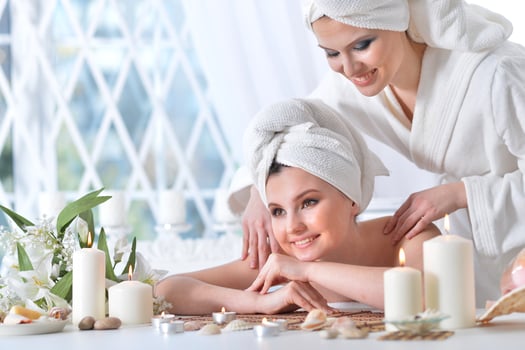 Beautiful woman in spa centar enjoying the massage. photo