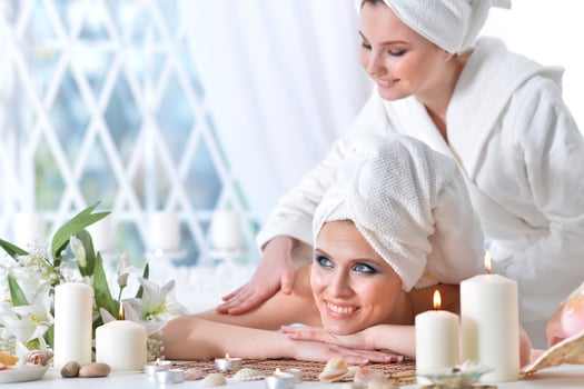 Beautiful woman in spa centar enjoying the massage. photo