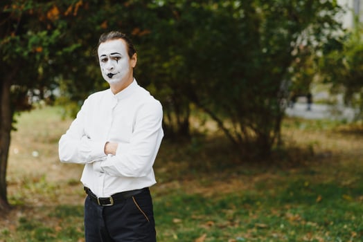 Portrait of a man, artist,clown, MIME. Shows something. Mime actor shows different emotions. photo