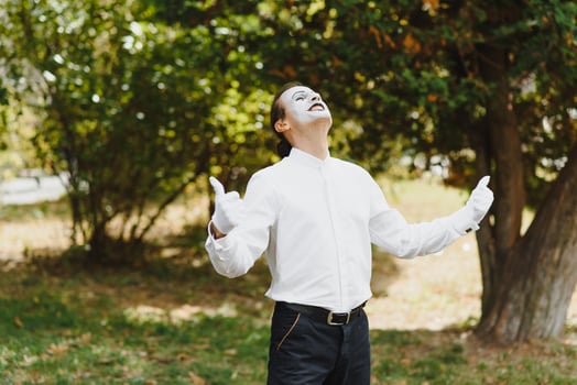 young Funny mime shows something. photo