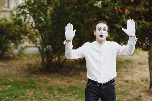 Portrait of a man, artist,clown, MIME. Shows something. Mime actor shows different emotions. photo