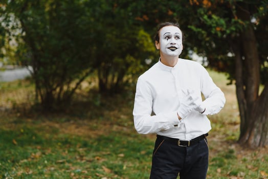 Portrait of a man, artist,clown, MIME. Shows something. Mime actor shows different emotions. photo
