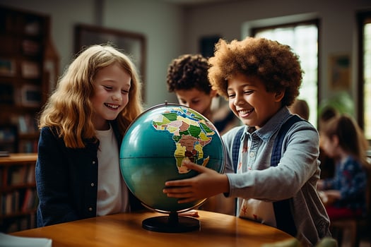 Group of different smiling kids in geography lesson with globe photo