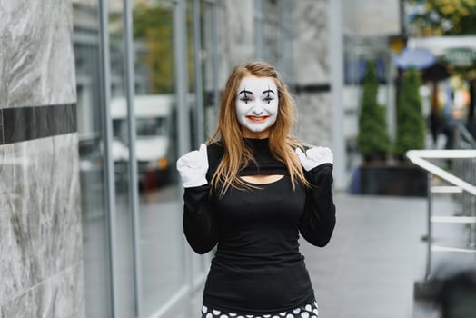The girl with makeup of the mime. improvisation. mime shows different emotions photo